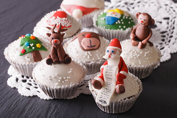 istock Beautiful Christmas cupcakes decorated fairy-tale figures close- 496731732