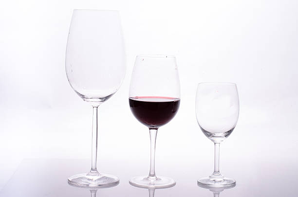 istock Red wine in a glass on white background 496734326