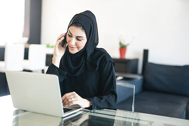 istock Beautiful Middle Eastern Woman Negotiating on Phone 496736366