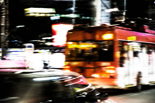 istock Cars and bus at night with blurred background 496740118