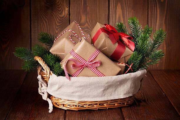 istock Christmas gifts and tree branch 496765286