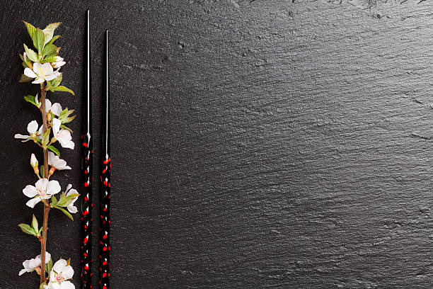 istock Japanese sushi chopsticks and sakura blossom 496766512