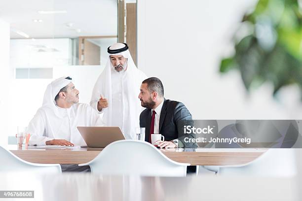 Three Arab Businessmen In Business Meeting In Modern Office Stock Photo - Download Image Now