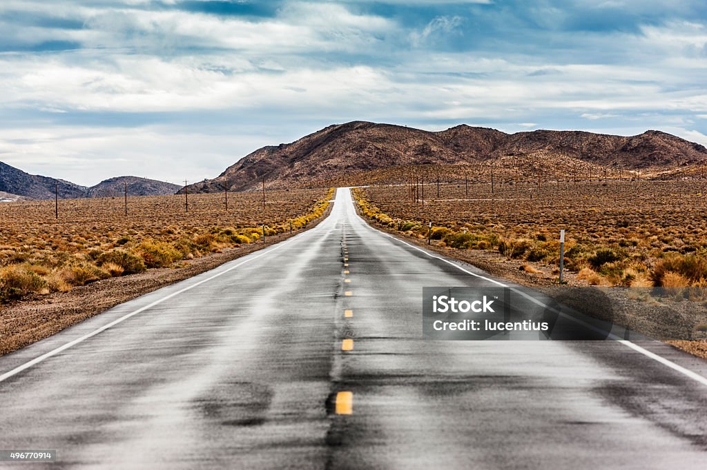 Highway 190, Death Valley, USA Long straight section of Highway 190 through Death Valley National Park, USA. Processed in AdobeRGB colorspace. 2015 Stock Photo