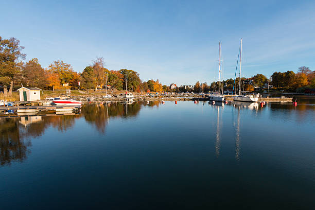 istock Boats in empty marina on early autumn morning 496773812