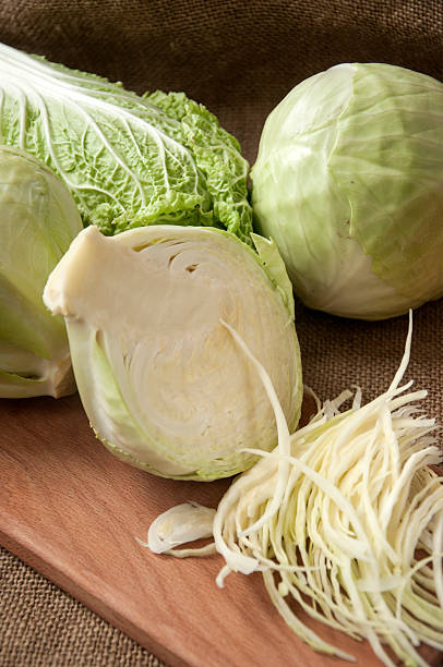 istock cabbage on a wooden board on a background sacking, burlap 496773970