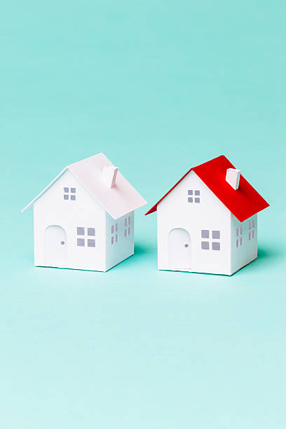 istock Two little paper house 496774294
