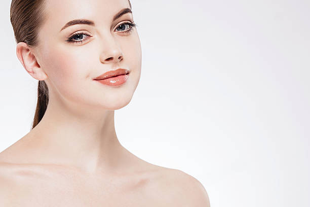 istock Beautiful woman face close up portrait happy studio on white 496774348