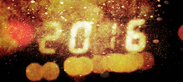 istock Happy new year 2016 written with Sparkle snow firework background. 496774432