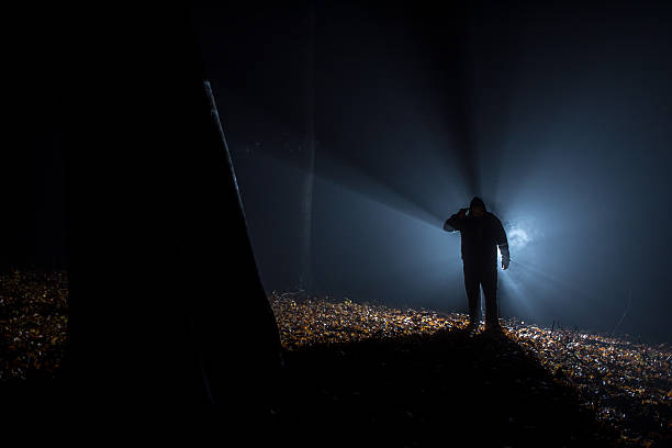 istock suicide people in the dark forest, gun in hand. 496774972