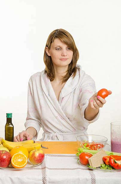 istock She picked up a tomato preparing a salad 496778166