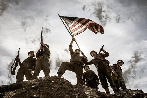 istock US Army Soldiers on hill with American Flag 496788678