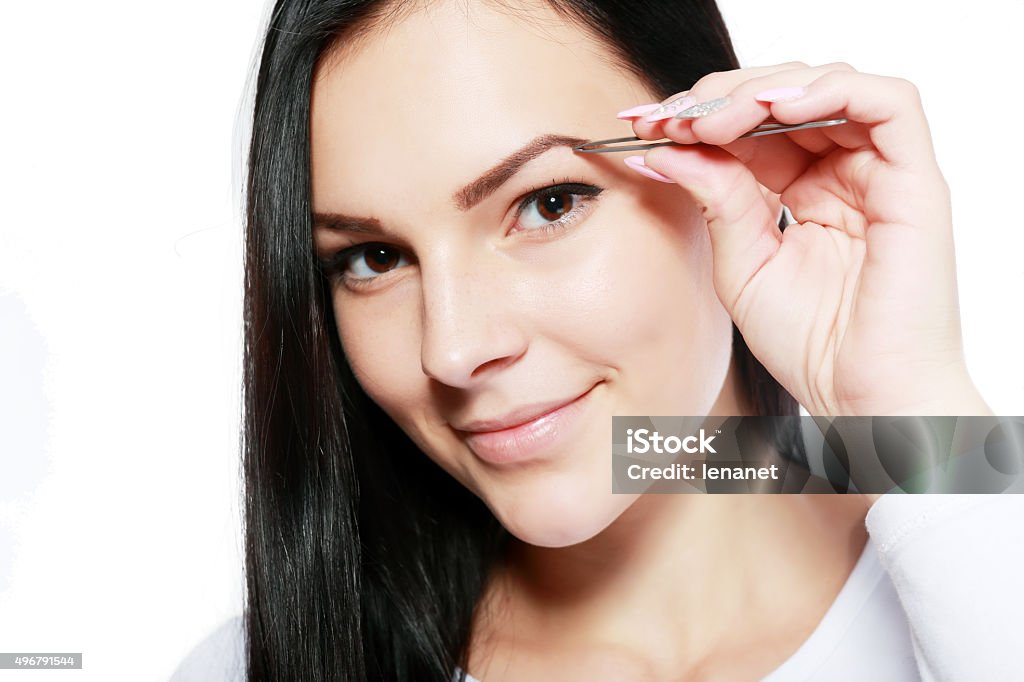 plucking tweezers brow young beautiful woman eyebrow plucking tweezers brow hair closeup portrait 2015 Stock Photo