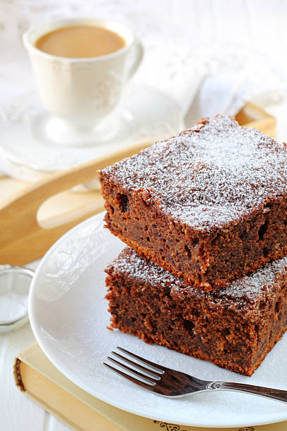 istock two pieces of plum cake with chocolate and almonds 496791654