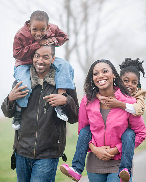 istock Family Happily Walking in the Park 496793380
