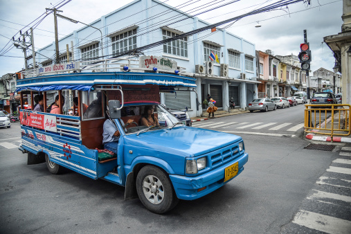 Phuket, Thailand – May 18, 2014:  Unidentified people travel by wooden minibus on May 18, 2014 in Phuket, Thailand.