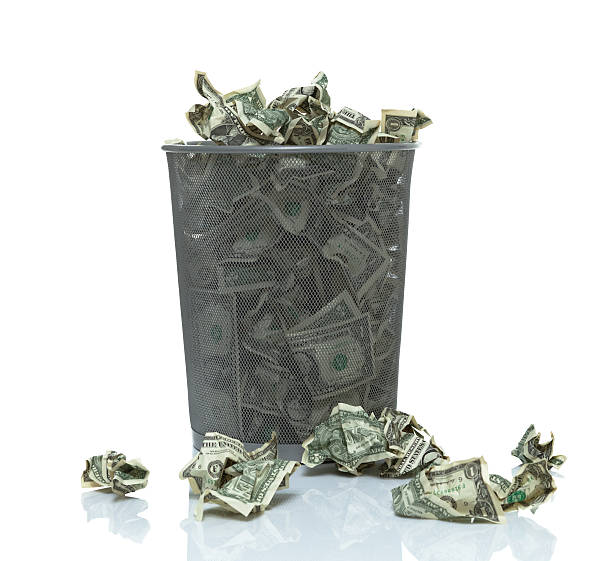 istock Trashcan full of money 496795366