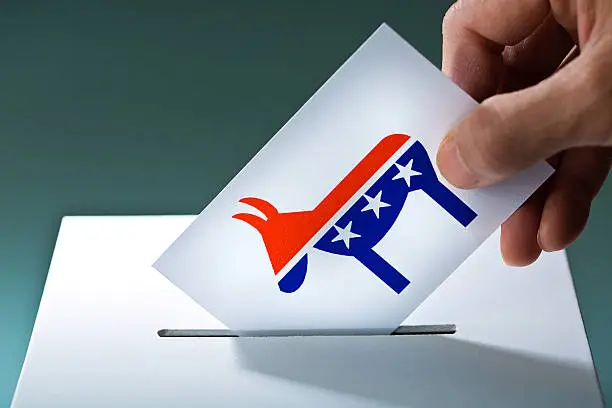 Photo of U.S. Election Voter Voting Democratic Party Ballot with Donkey Symbol