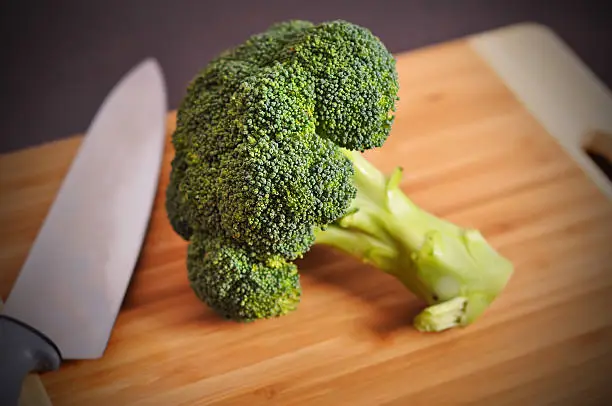fresh green broccoli on a  chopping board