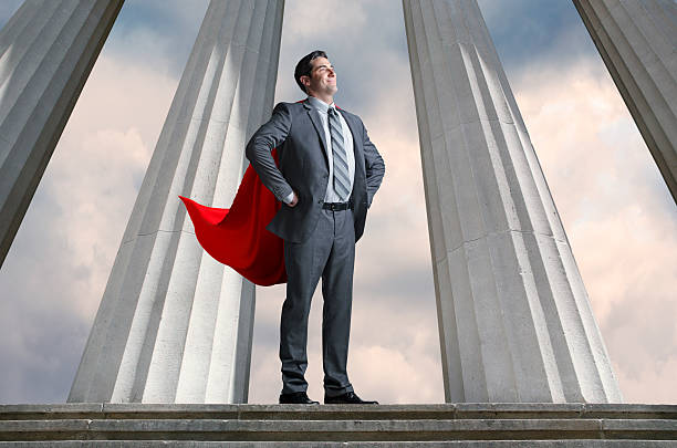 istock Superhero Businessman With Tall Pillars In The Background 496796150
