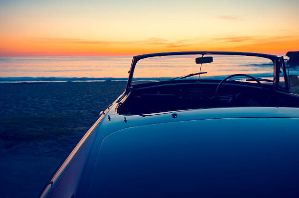 istock Convertible at the beach at sunset or sunrise. 496796374