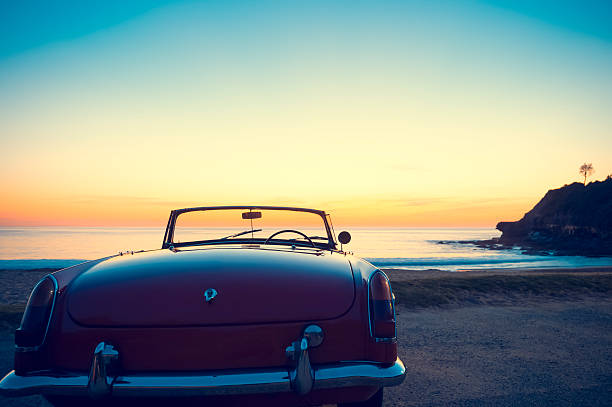 istock Convertible at the beach at sunset or sunrise. 496796424