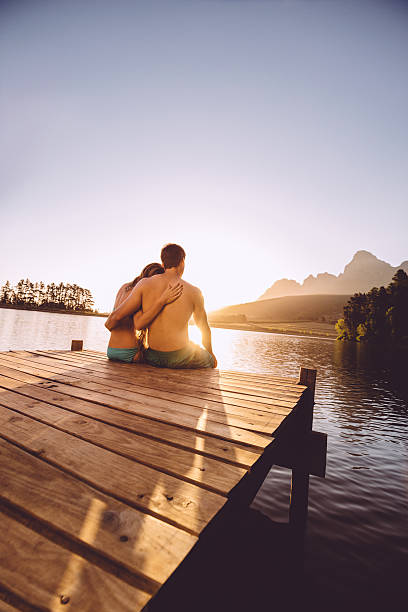 istock Loving couple on a jetty 496797363
