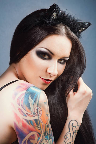 istock pretty young girl with tattoo. 496797521