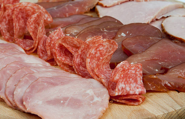 istock Salami sausage slices and ham 496798264