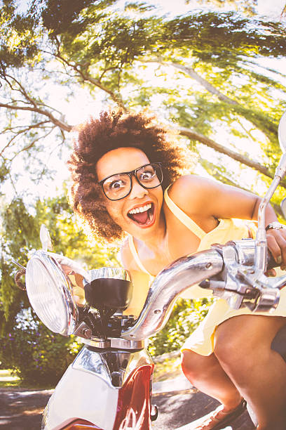 istock Nerdy Woman on scooter with mouth open 496798295