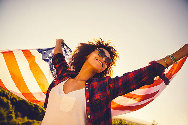 istock Girl is waving american flag 496798423