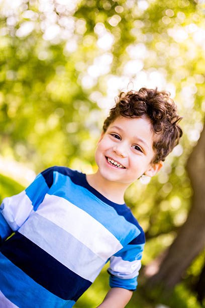 istock Happy boy smiling in park 496798451