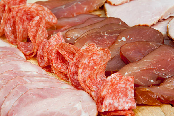 istock Salami sausage slices and ham 496798472