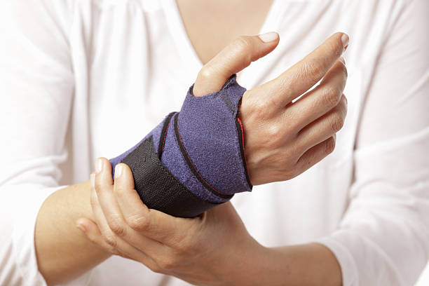 Bandage A woman has a bandage on her twisted wrist. carpal tunnel syndrome photos stock pictures, royalty-free photos & images