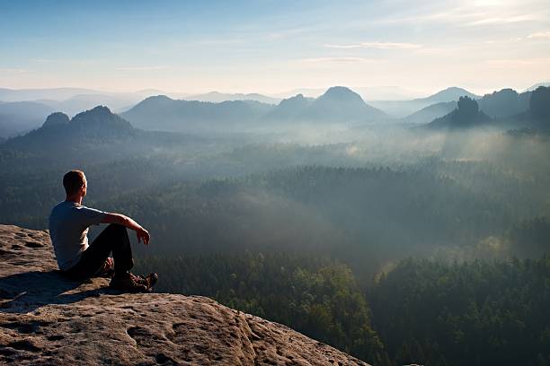 istock Tall short hair hiker on rock and enjoy mountain 496798908