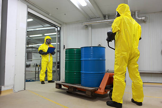 istock Two specialists in protective uniforms dealing with toxic substance 496799313