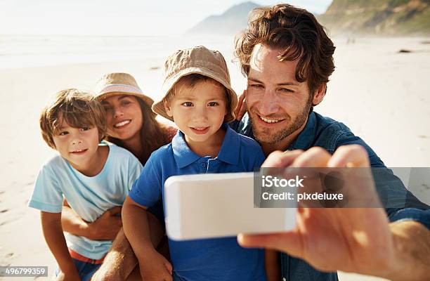 Family Taking Photo Of Themselves On Beach Stock Photo - Download Image Now - Beach, Family, Men