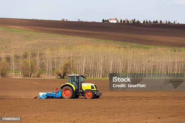 Tractor Plowing The Fields Stock Photo - Download Image Now - Agricultural Field, Agricultural Machinery, Agriculture