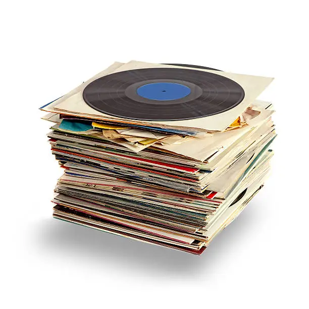 Vinyl records stack with blue labeled disk on top