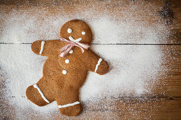 istock Gingerbread man on wood, suitable snow and winter 496800690