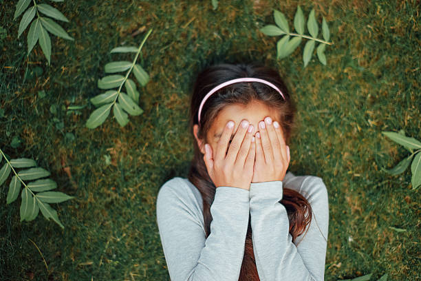 istock Girl standing on the grass and smile 496801430