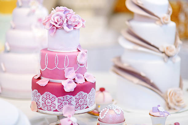 istock White wedding cake decorated with sugar flowers 496803296
