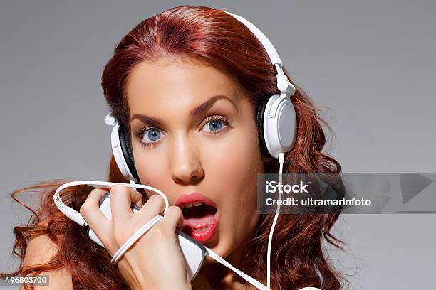 Music Beauty Portrait Young Women Listening To Headphones And Singing Stock Photo - Download Image Now
