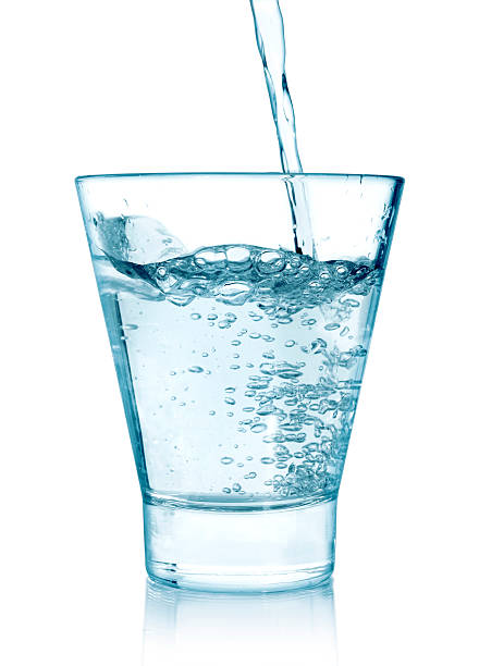 istock pouring water on a glass 496803816