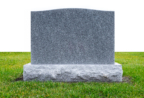 Blank gravestone with other graves in the backgroun