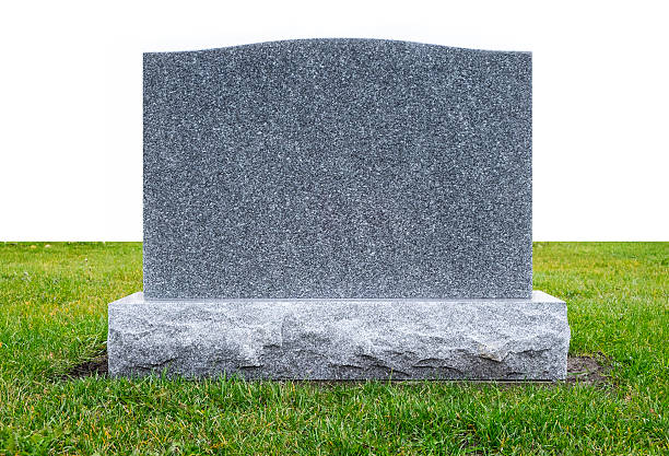 Granite Monument Stone on Green Grass Plain Gray Granite Monument Stone on Green Grass tombstone stock pictures, royalty-free photos & images