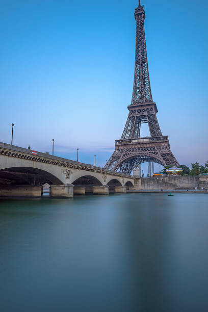 istock Long Exposure of Eiffel Tower and Seine River at sunset 496812871