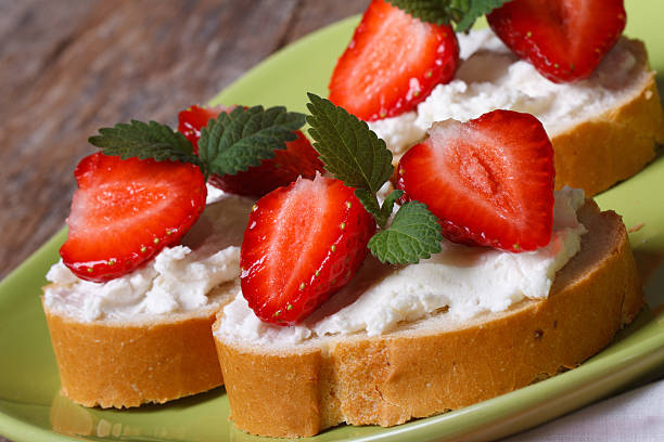 istock strawberries sandwiches with cream cheese and mint closeup 496815965