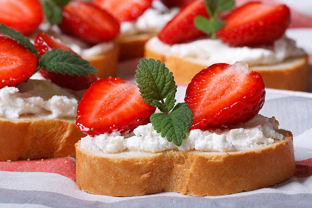 istock sandwiches with strawberries, cream cheese and mint.  Macro 496815983