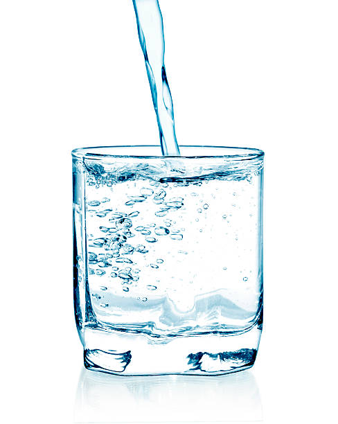 istock pouring water on a glass 496818368